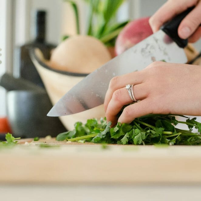 Chopping Cilantro in Kitchen